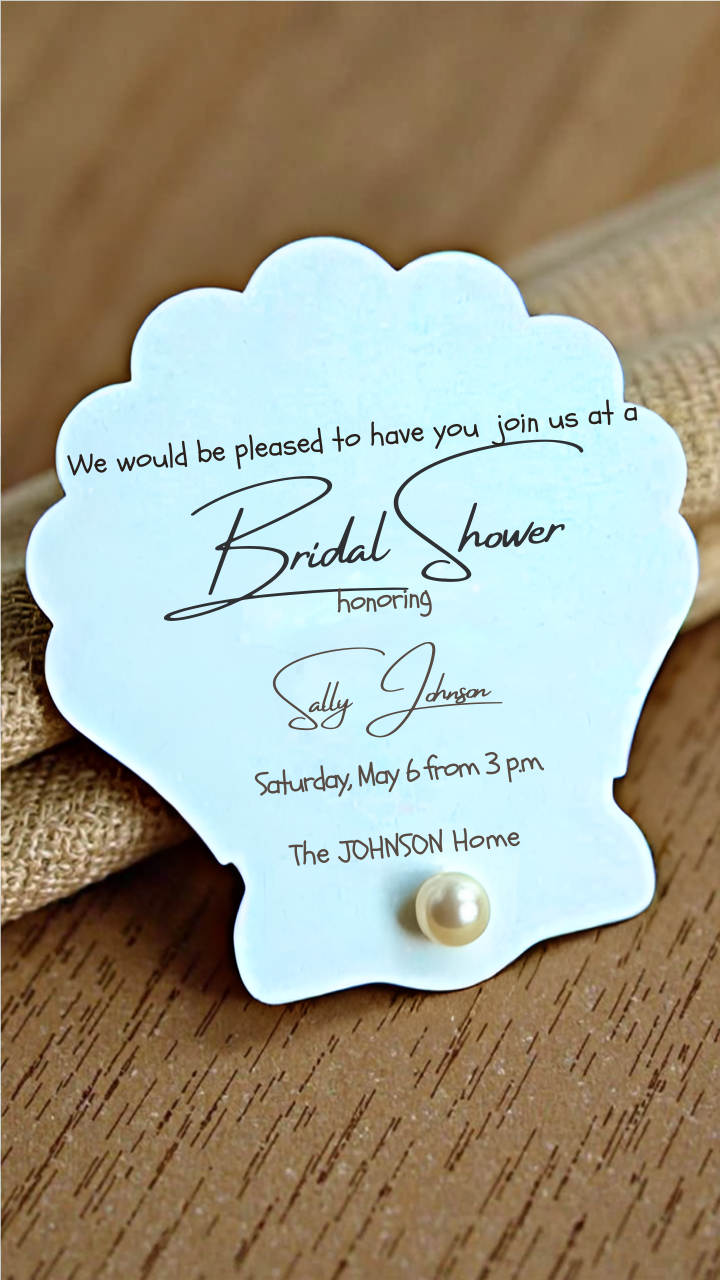 Seashell-shaped bridal shower invitation in soft blue, featuring elegant script text and a pearl embellishment, perfect for a mermaid or beach-themed bridal shower