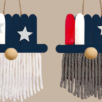 DIY Uncle Sam wall hanging craft made with red, white, and blue popsicle sticks, yarn beards, and star decorations for Fourth of July.