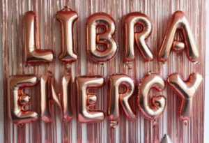 Libra party photo backdrop with rose gold balloon letters
