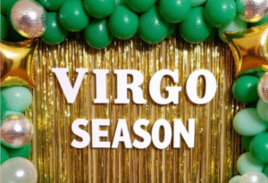 Green and gold balloon and tinsel Virgo season photo backdrop.