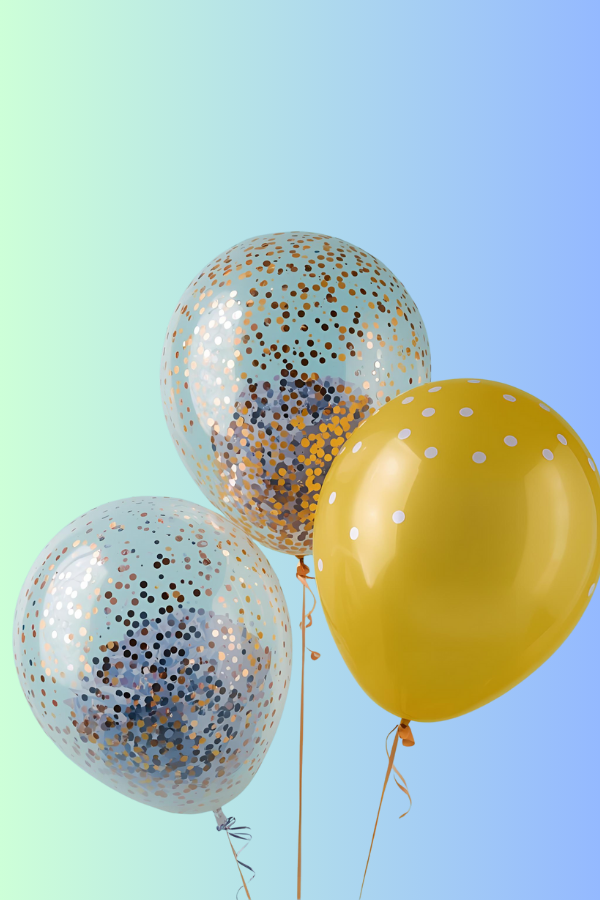 Three colorful confetti balloons, two clear with metallic confetti inside and one solid yellow balloon with white dots, against a soft pastel gradient background.