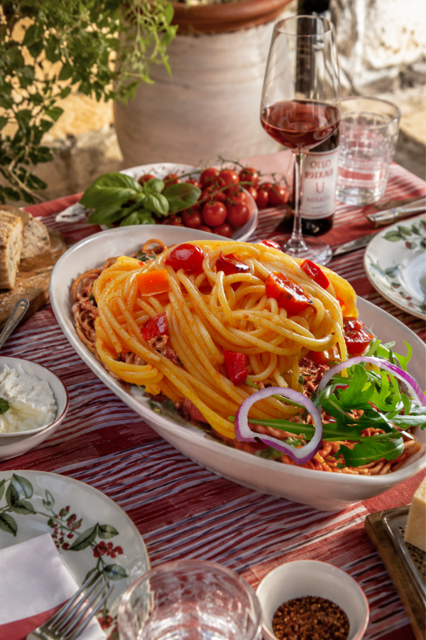 Fresh pasta al pomodoro served family-style at a Tomato Girl Summer dinner party.