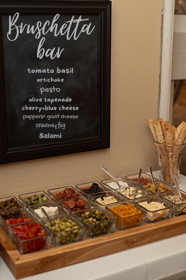 Elegant DIY bruschetta bar with customizable toppings, breadsticks, and an Italian-inspired appetizer display for summer entertaining.